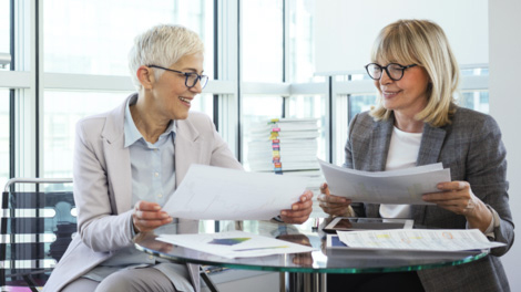 Women reviewing investment strategies